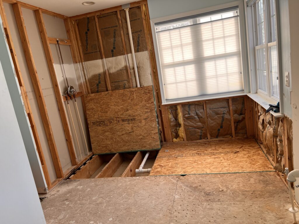 Bathroom remodel subfloor repair and new plywood installation with updated plumbing in Harford County home