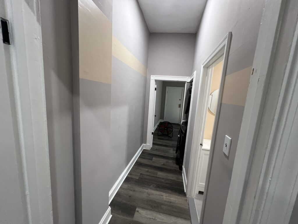 Accent stripes to cover wall damage without re-painting the entire apartment in between tenants.
